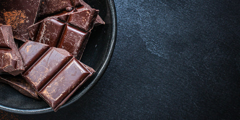 chocolate (delicious cocoa dessert, pieces of sweets) menu concept. food background. top view. copy...