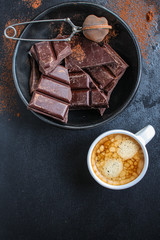 chocolate (delicious cocoa dessert, pieces of sweets) menu concept. food background. top view. copy space