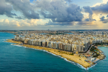 Aerial view of Sliema city. Winter, sea, seafront, cloudy sky. Malta island