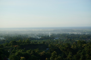 Plateau with a few trees under the foot of the mountain and was once a wilderness