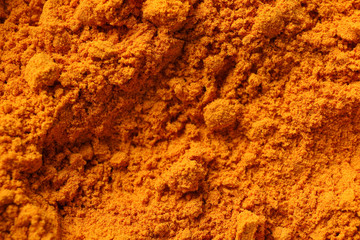 Paprika powder spice texture background, close up