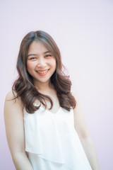 Fototapeta premium Fashion asian women smiling portrait on pink background