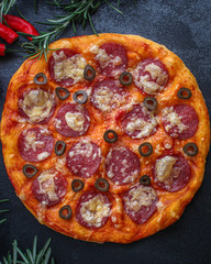 salami pizza with cheese (dough, tomato sauce and other ingredients) menu concept. food background. top view. copy space