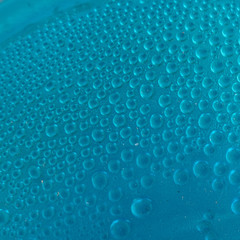 Blue water drops background close up
