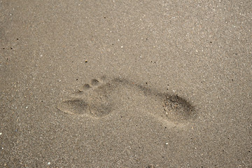 Background image Footprints on the brown sand