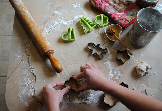 The process of making ginger cookies. Girl is preparing cookies. Gluten free from rice flour. Housewife makes christmas cookies. Close up close shot