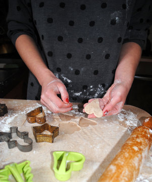 The process of making ginger cookies. Girl is preparing cookies. Gluten free from rice flour. Housewife makes christmas cookies. Close up close shot