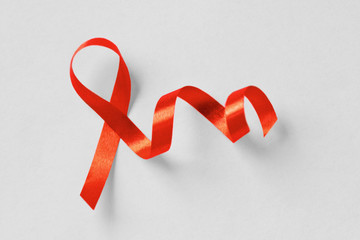 Red ribbon on white background - Aids awareness concept