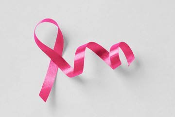 Pink ribbon on white background - Breast cancer concept