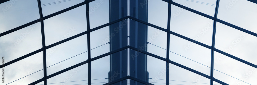 Poster girders and glass roof panels. close-up fragment of minimalist business building interior. abstract 