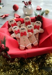 Plate with tasty Christmas cookies on wooden table