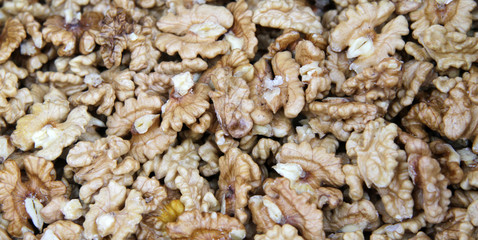 Peeled walnuts full frame photo. Walnuts pattern. Kernels.