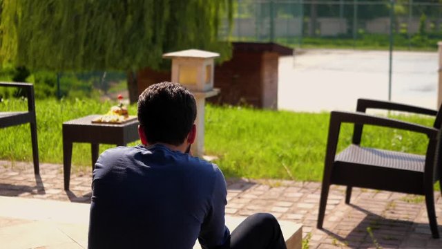 anonymous photographer taking photos of a foods on table medium shot of a man doing food photography slow-motion outdoors