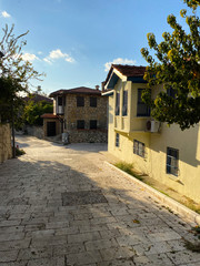 Fototapeta na wymiar Small houses along the road. Turkey, Side. November 5, 2019.