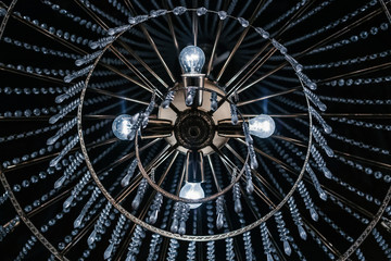 Church chandelier bottom up perspective. Lights on. Abstract background