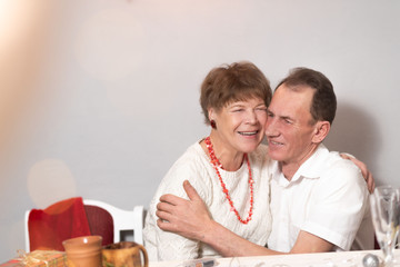 Man and woman laugh hugging. An elderly couple in the New Year. Valentine's Day