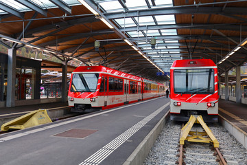 Zermatt, Switzerland-October 21, 2019:The red train stop on railway at station before go to zermatt...