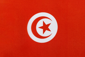 Flag of the Tunisian Republic on a textile basis close up