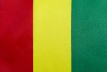 Flag of the Republic of Guinea on a textile basis close-up