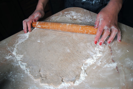 The process of making ginger cookies. Girl is preparing cookies. Gluten free from rice flour. Housewife makes christmas cookies. Close up close shot .  honey mortar, liquid honey