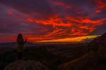 Girl in the mountains with wine