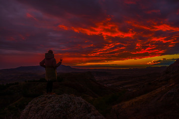 Girl in the mountains with wine