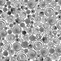 Seamless geometric background. Spiral. Black and white pattern. Hand-drawn spirals of different sizes.