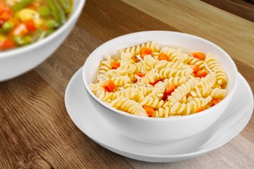 Bowl of delicious vegetable soup on a table