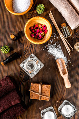 spa composition for body care with salt on wooden background top view