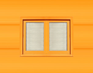 Window with blinds on orange wall