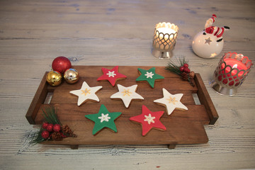 Plate with tasty Christmas cookies on wooden table