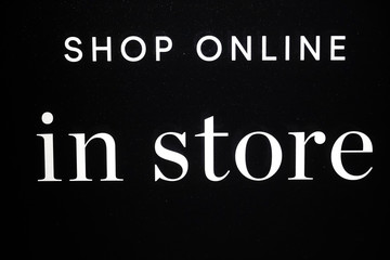 Stockholm, Sweden A shop window sign saying :"Shop online in store."