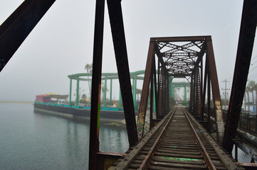 Old railway truss bridge over little bay in Santa Cruz, California