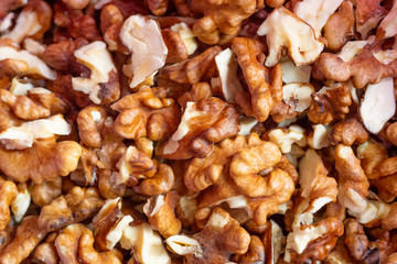 Closeup of big shelled walnuts pile on the table