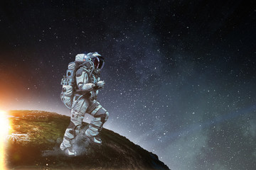 Obraz na płótnie Canvas Exploring outer space. Mixed media