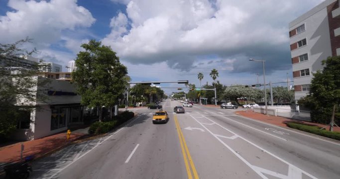 A high angle reverse view driving in Miami, Florida.  	