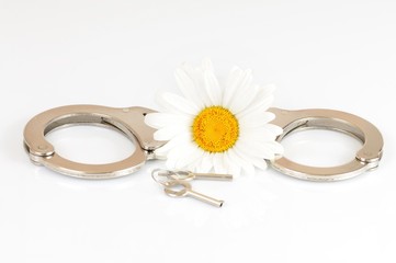 Close-up chrome handcuffs and keys