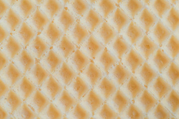 Waffles background cell texture closeup. View of tasty waffles