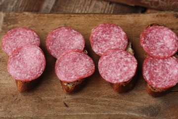 Sandwiches with bread and sausage on the table 