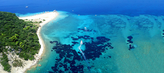 Aerial drone ultra wide photo of secluded turquoise exotic paradise bay with sandy beach