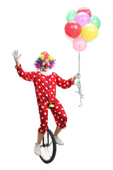 Happy clown riding a unicycle, holding a bunch of balloons and waving at the camera © Ljupco Smokovski