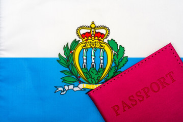 On the background of the flag of San Marino is a passport.