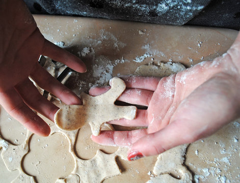 The process of making ginger cookies. Girl is preparing cookies. Gluten free from rice flour. Housewife makes christmas cookies. Close up close shot