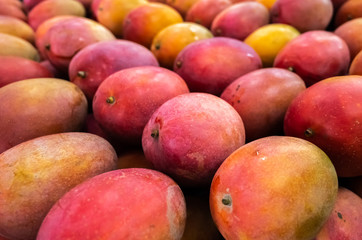red stacks of mango fruits