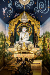 Thai Buddha statue. Buddha image in the middle. Statue of Buddha sitting in meditation.