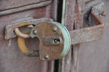 Padlock on ancient door. Old lock