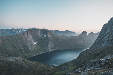 Midnight sun with view of a Fjord in Senja from Grytetippen