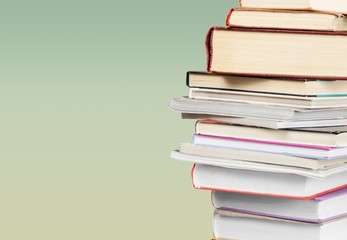 Collection stack of old retro books on background
