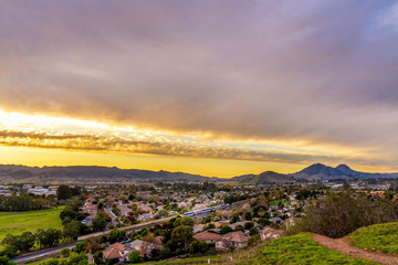 Sunset in the Hills with Town and Train