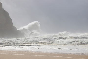 Big wave clashing against cliffs in Nazare